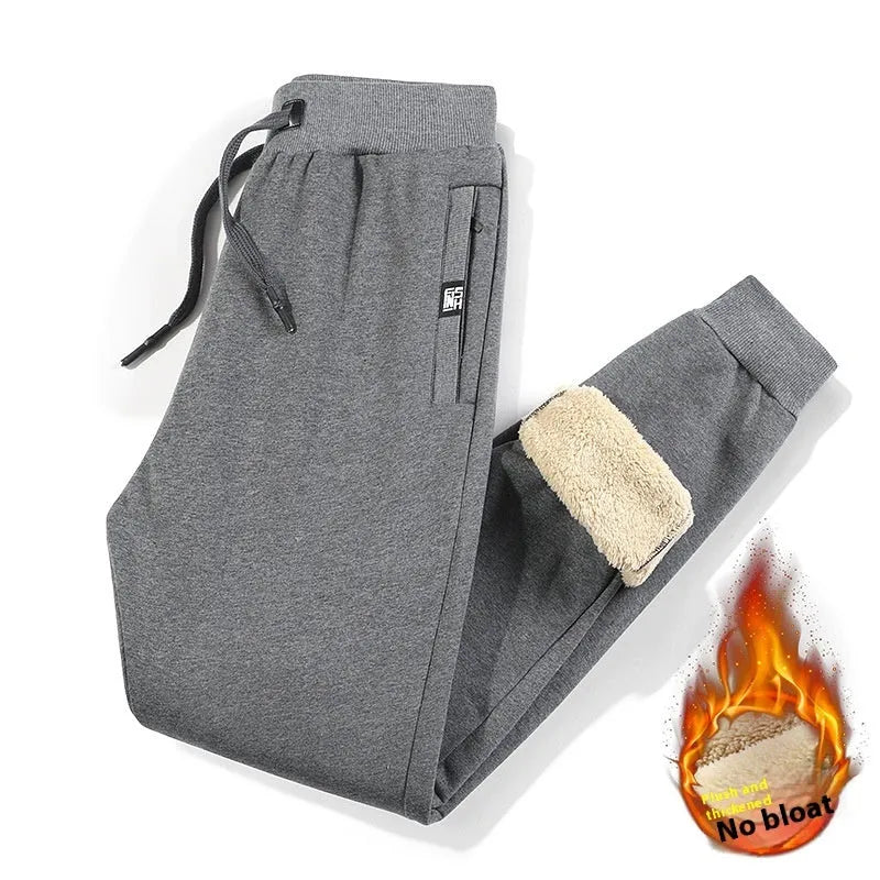 Men's grey fleece-lined oversized cotton track pants with an elastic mid-waist.