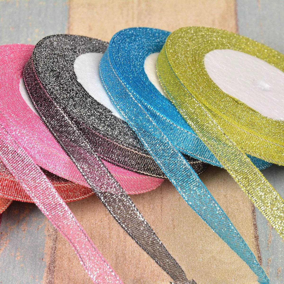 Polyester ribbon spool in metallic colours for decorative clothing and gift packaging trim