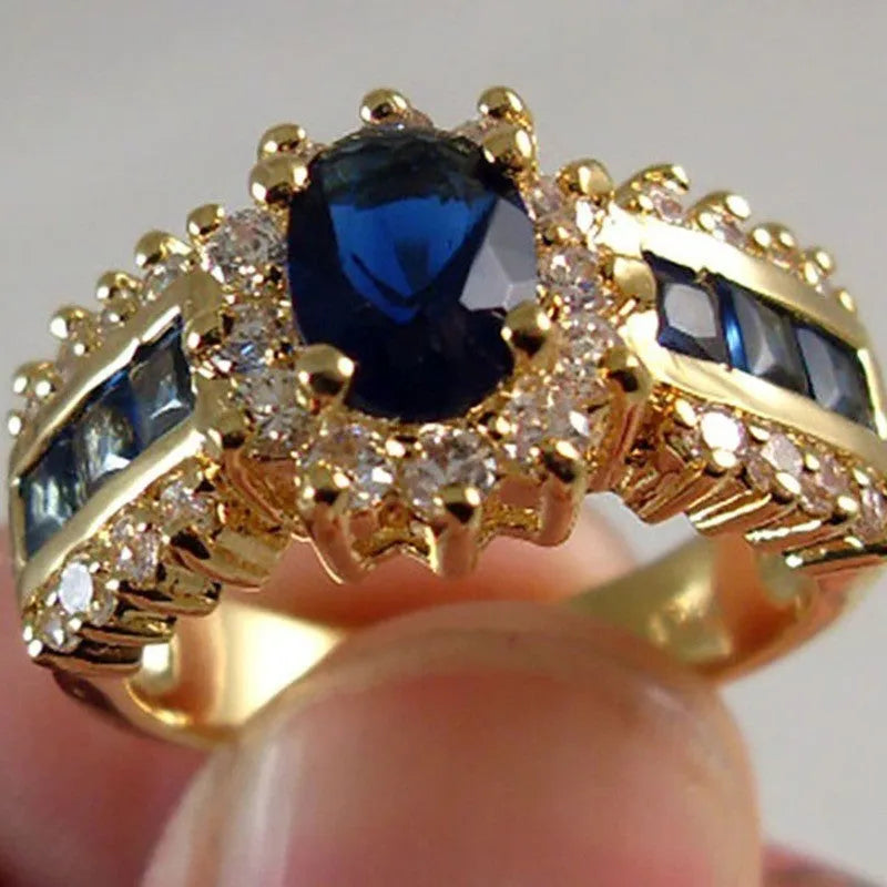 Personalised zinc alloy ring with diamond treatment in sunflower blue or square purple and blue zircon designs.