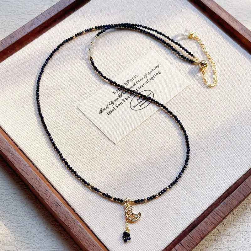 Handmade multi-layer women's bracelet in blue sand colour with three rings and stone-cut beads.