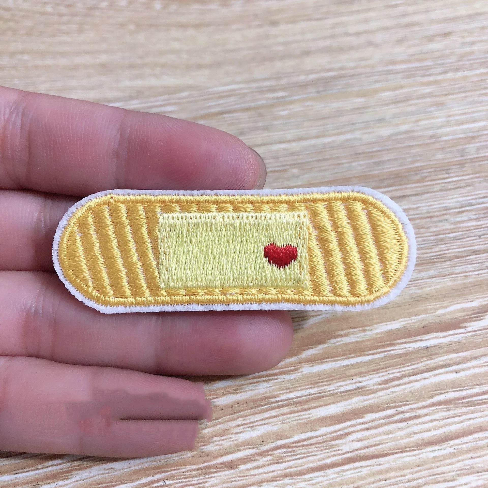 Ten computer embroidered fabric patches with detailed raised designs for clothing decoration