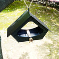 Simple European-style iron bird food nest in black or white for outdoor garden decoration.