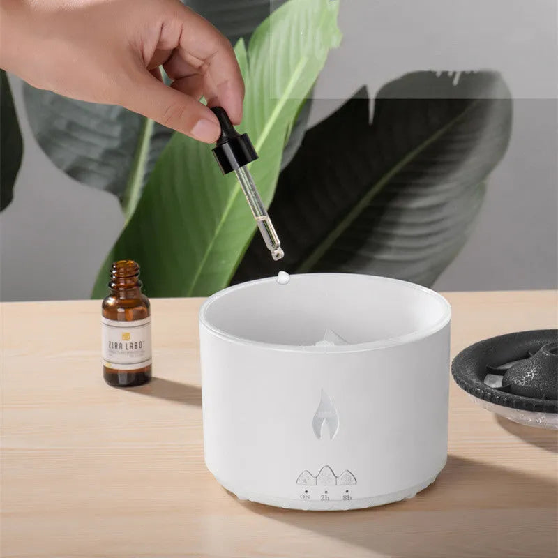 White volcano-shaped humidifier emitting a two-colour mist spray ring.