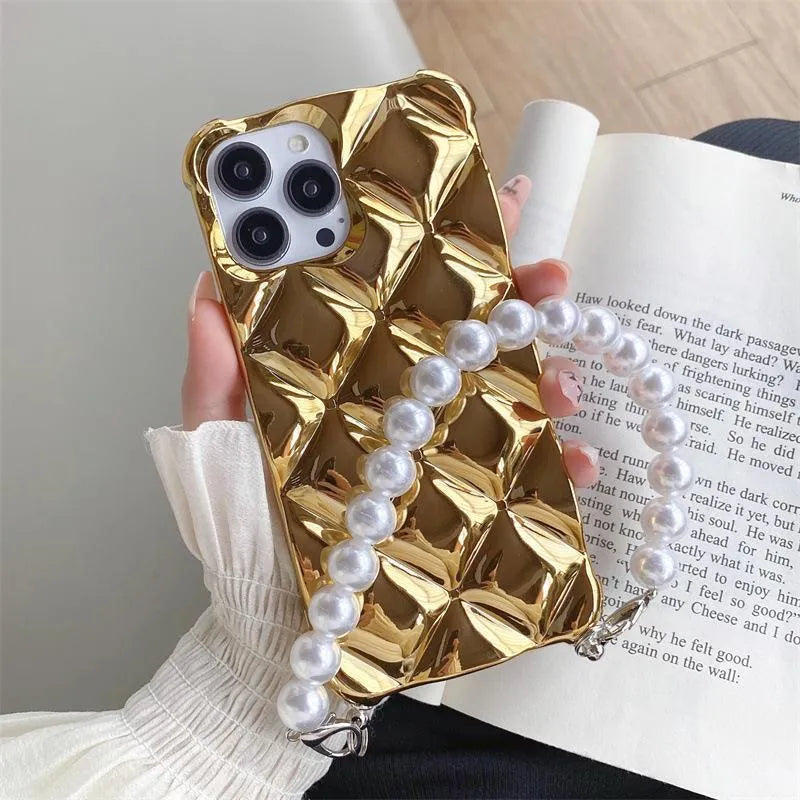 Gold diamond bracelet attached by chain to a TPU phone case for iPhone.