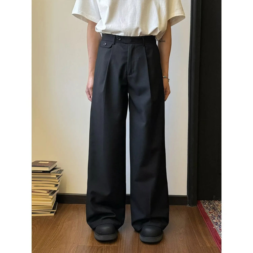 Men's straight-leg casual trousers in polyester blend fabric showing drape and wider cut design