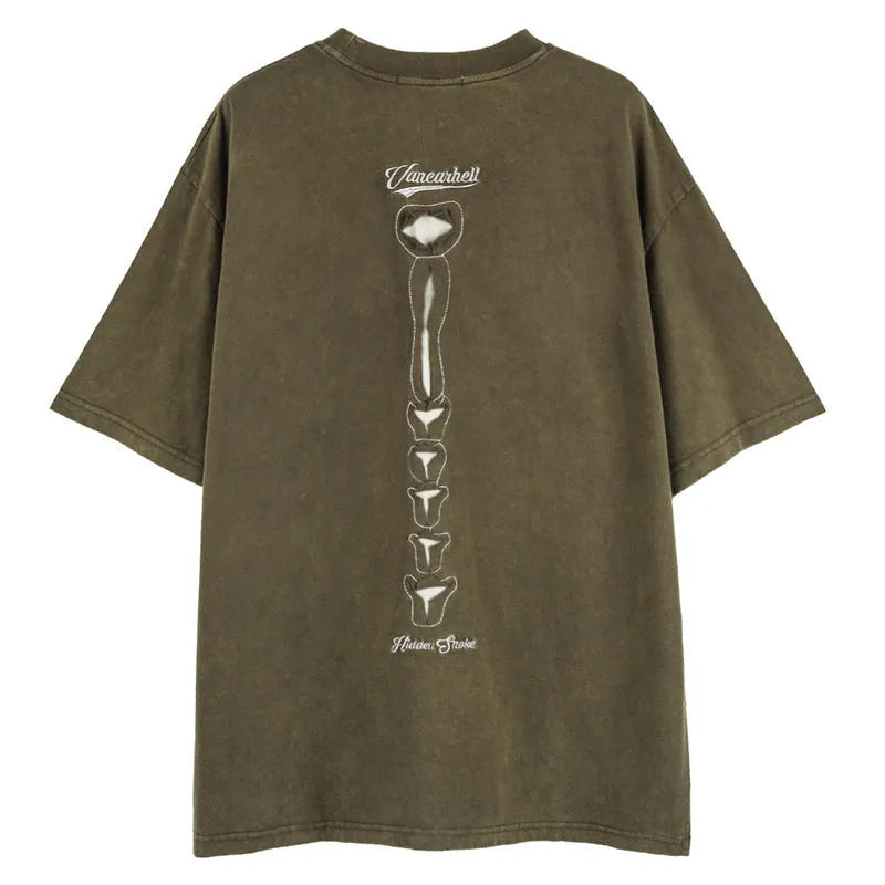 Brown loose fit men's T-shirt with a large printed skull and letter design, featuring drop shoulder sleeves.