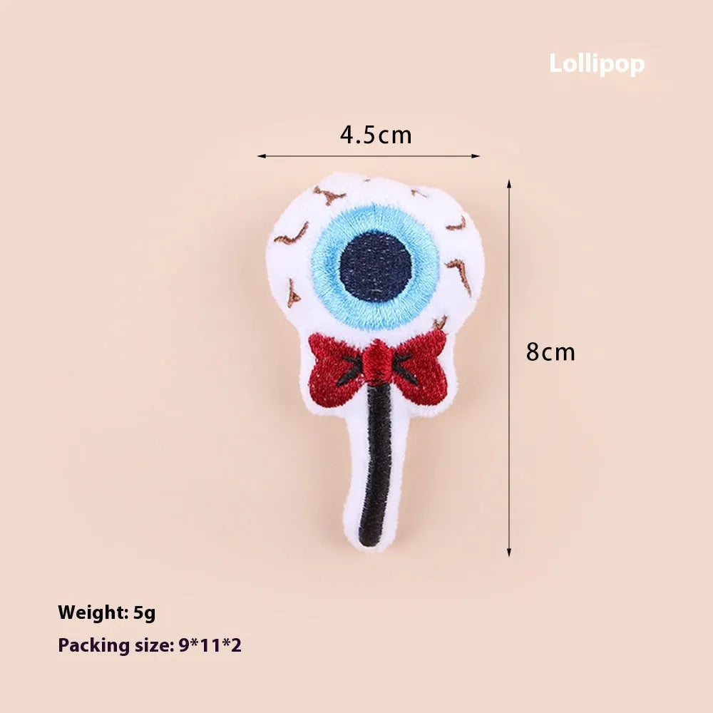 Colourful plush cat teaser wand with candy, eyes and skull animal shapes for interactive play
