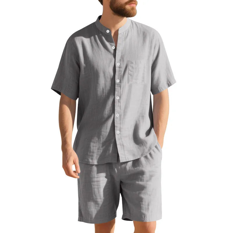 Man wearing a light blue linen blend short sleeve shirt and matching shorts, a casual summer two-piece suit.