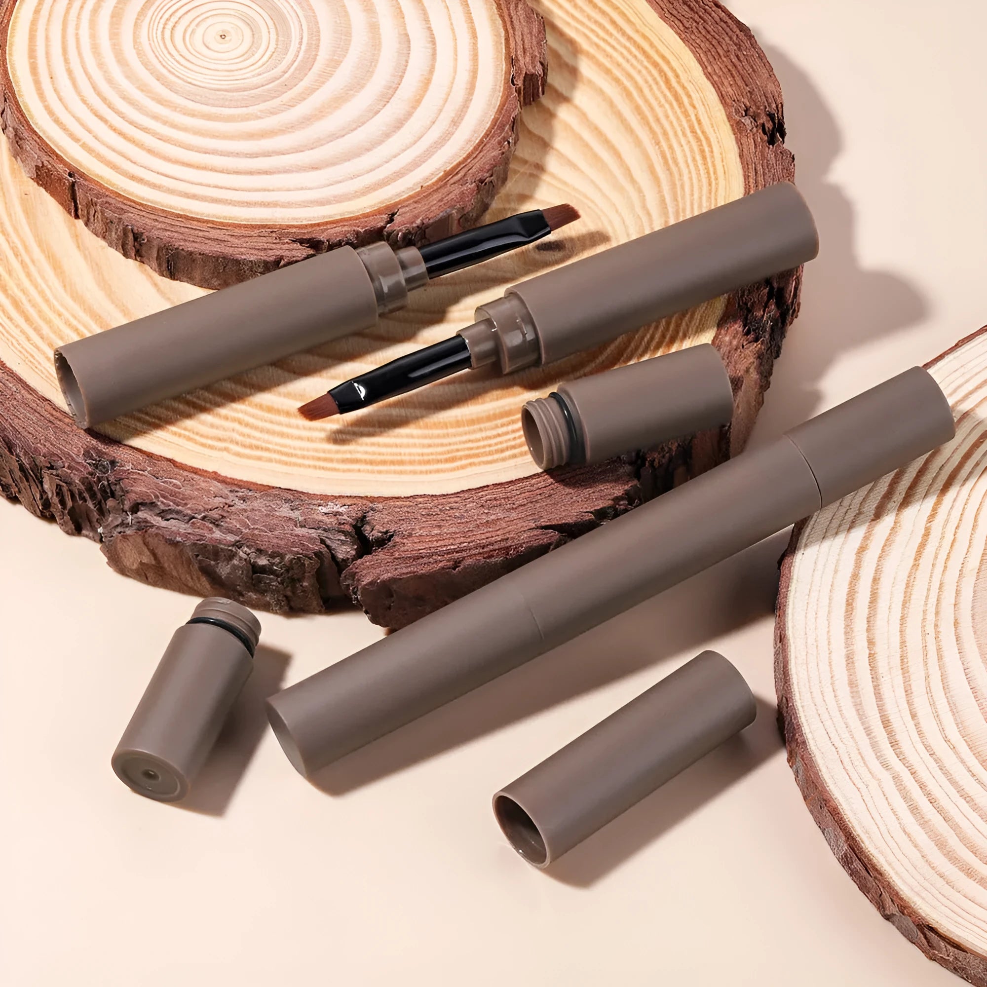Double-headed eyebrow cream showing pencil and powder ends with five shade options displayed.