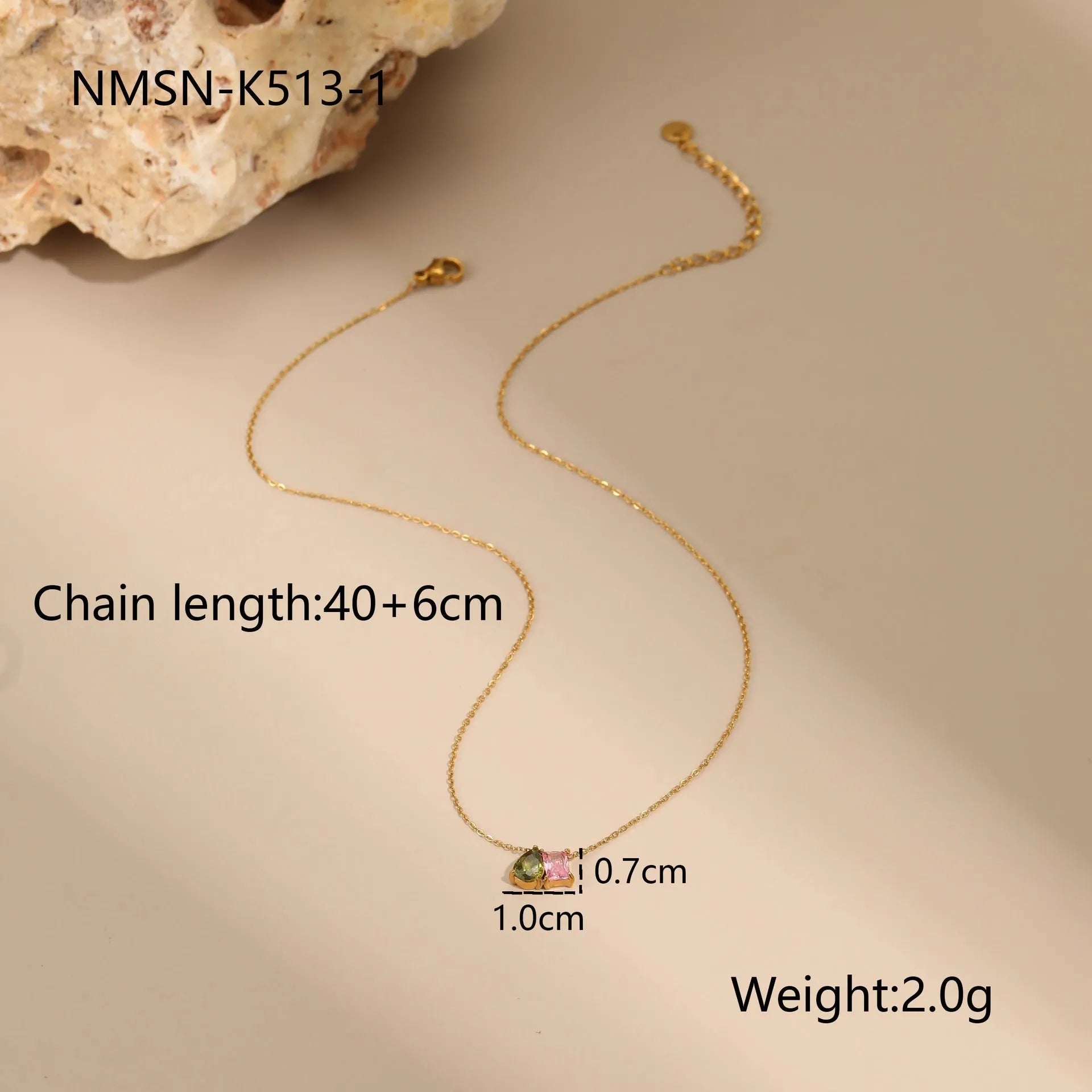 Geometric gold-plated jewellery set showing necklace, ring, and earrings on stainless steel with 18K plating