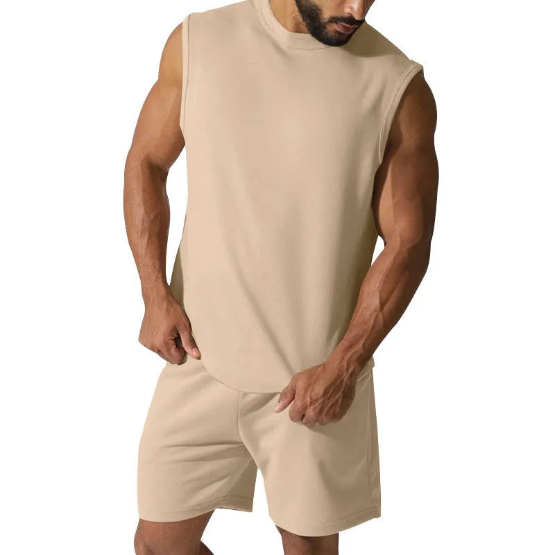 Men's sleeveless cotton blend sports top and shorts set in a solid colour.