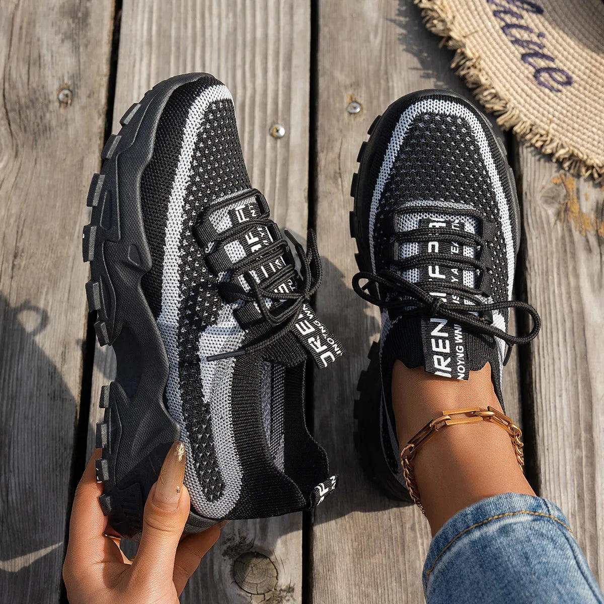 Women's Flyknit mesh lace-up sneakers in multiple colours on a rubber sole.