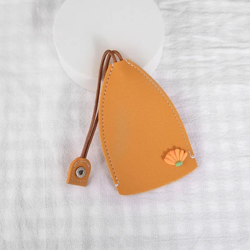 Cartoon pull-out car key case in PU leather with colourful designs measuring 14 x 7.5 cm