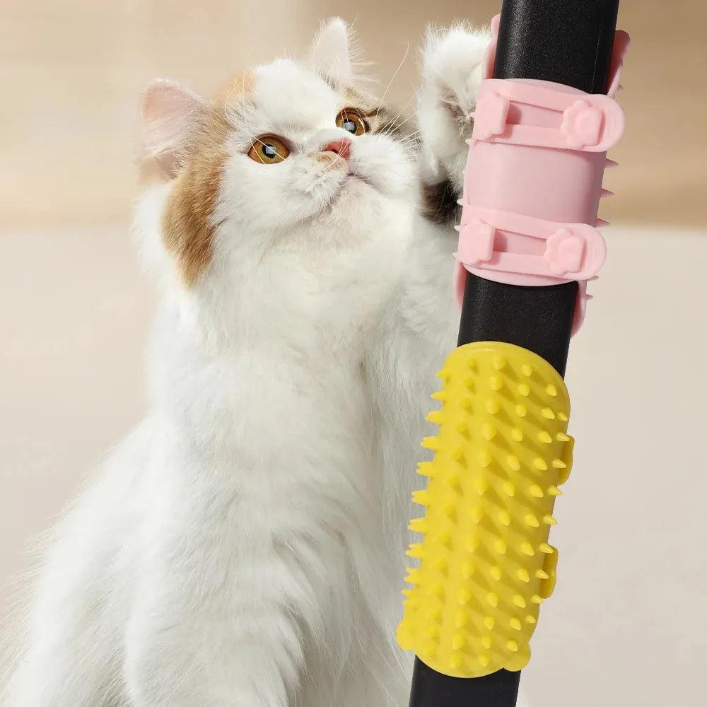 Silicone cat self-grooming brush with comb teeth and adjustable strap for table legs.