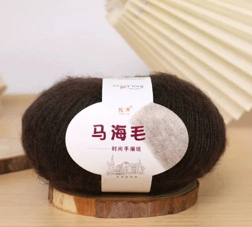 Single ball of mohair yarn in various colours for hand-woven DIY scarf knitting projects