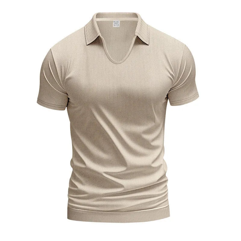 Man wearing a loose-fit apricot coloured V-neck short sleeve cotton blend T-shirt.