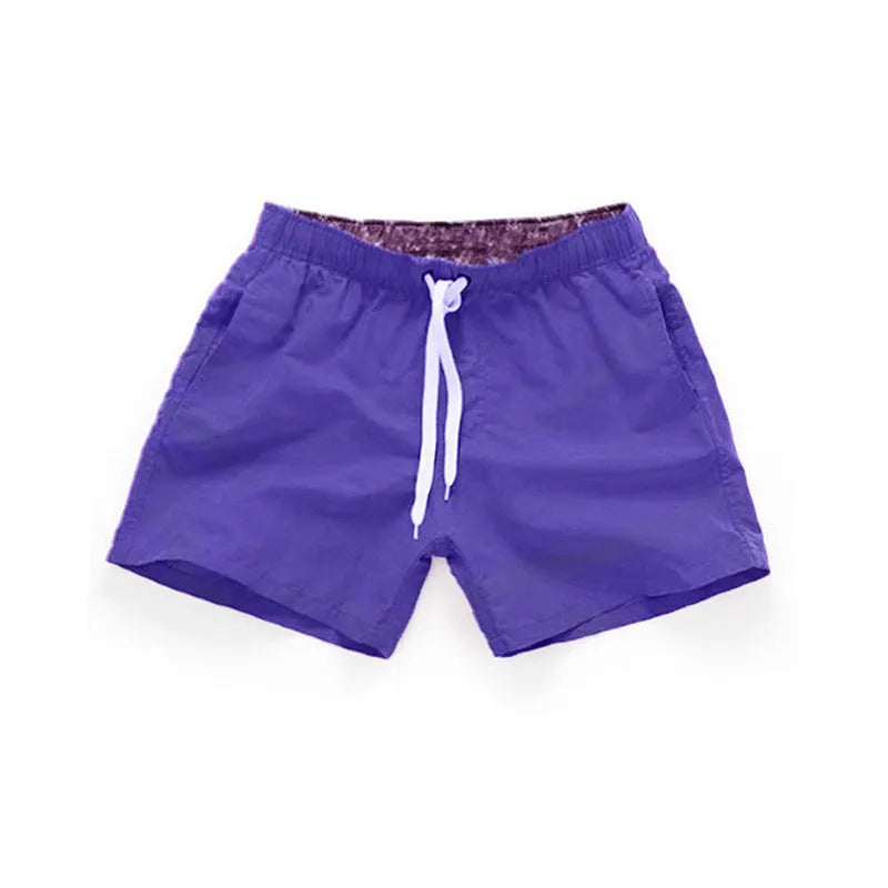 Men's straight leg beach shorts in multiple colours, made from polyester fabric, shown on size chart from S to 4XL.