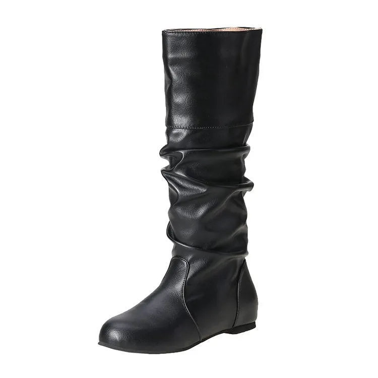 Women's black slip-on flat boots with round toe and high cylinder design on a neutral background.