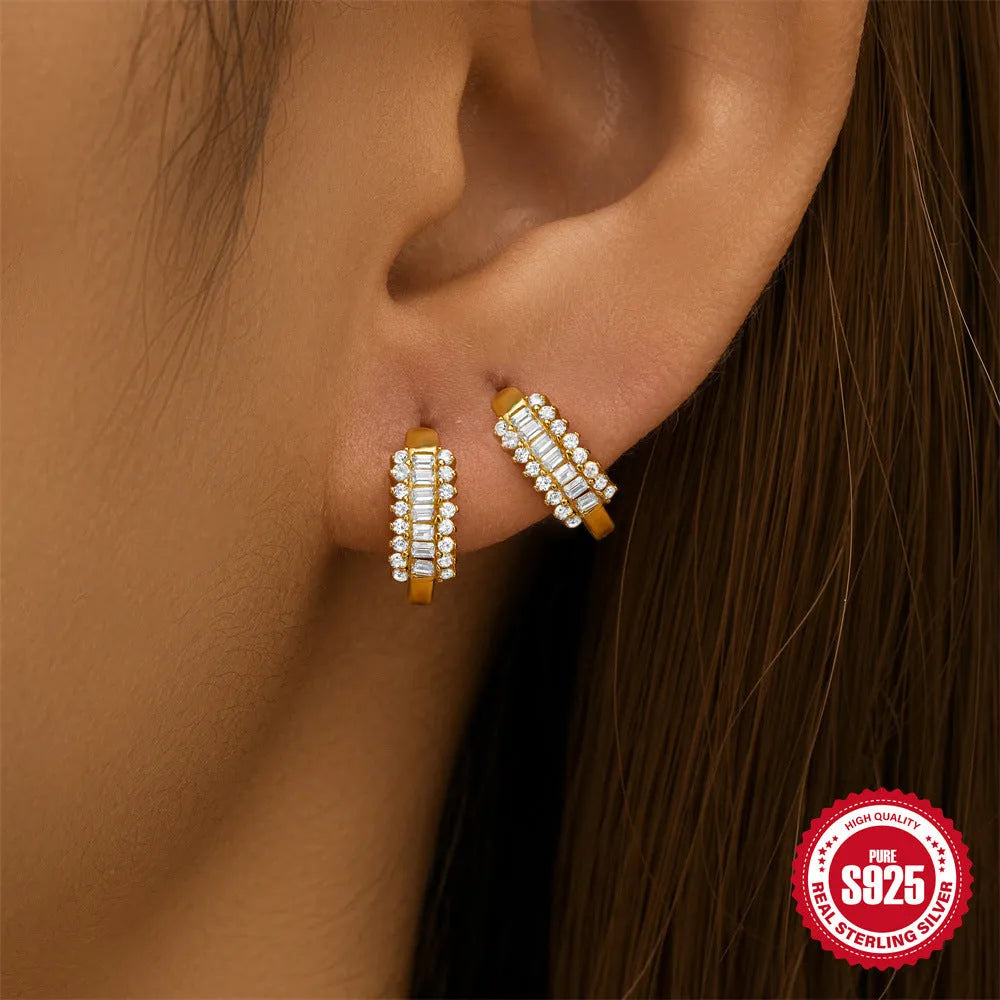 Sterling silver geometric stud earrings with small round diamond detailing in gold and silver electroplated finishes