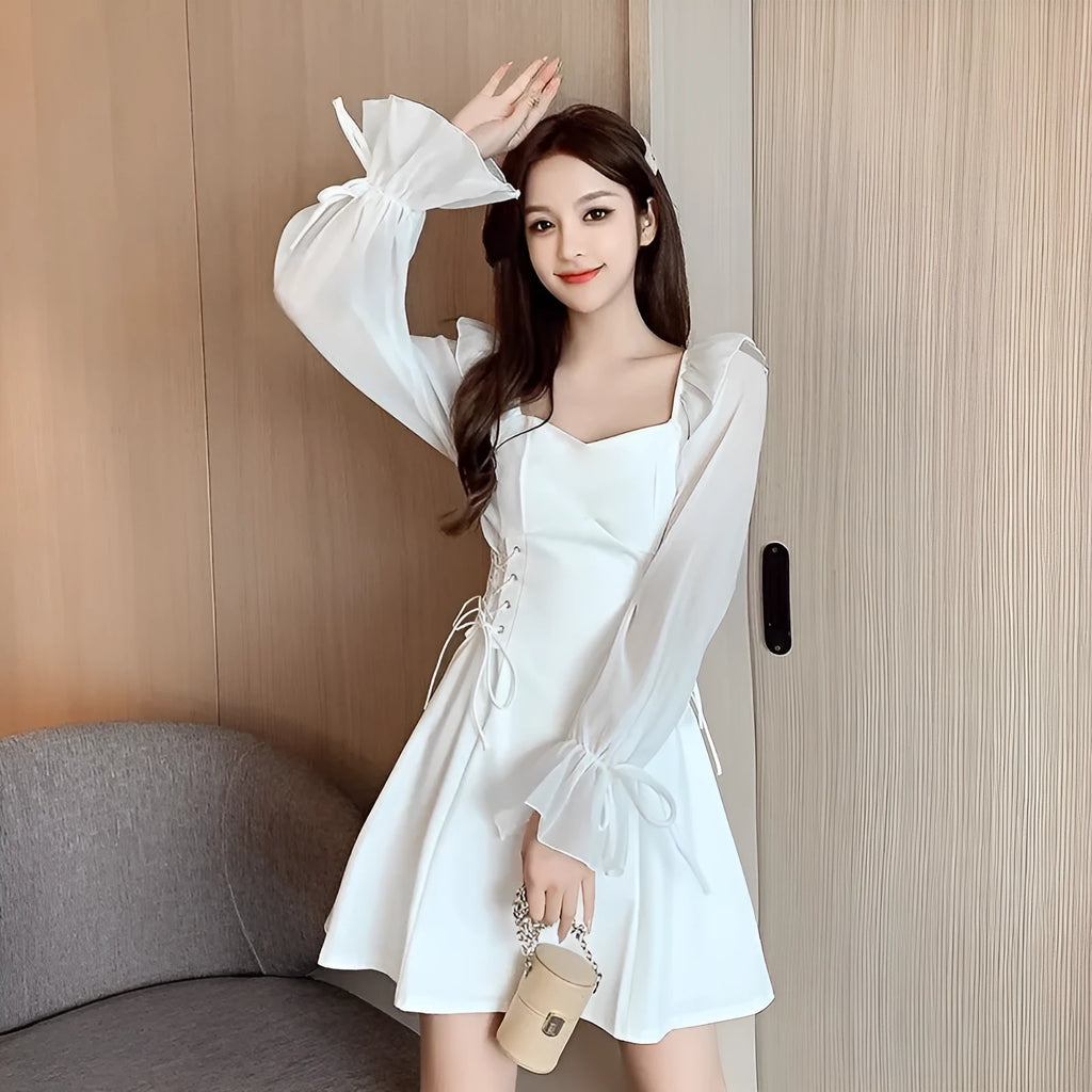 White women's chiffon dress with patchwork pattern and long sleeves, shown in a waist-slimming fit.