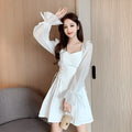 White women's chiffon dress with patchwork pattern and long sleeves, shown in a waist-slimming fit.