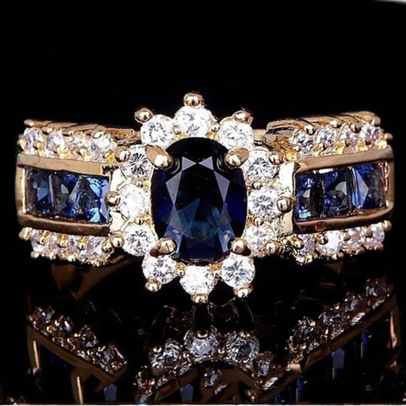 Personalised zinc alloy ring with diamond treatment in sunflower blue or square purple and blue zircon designs.