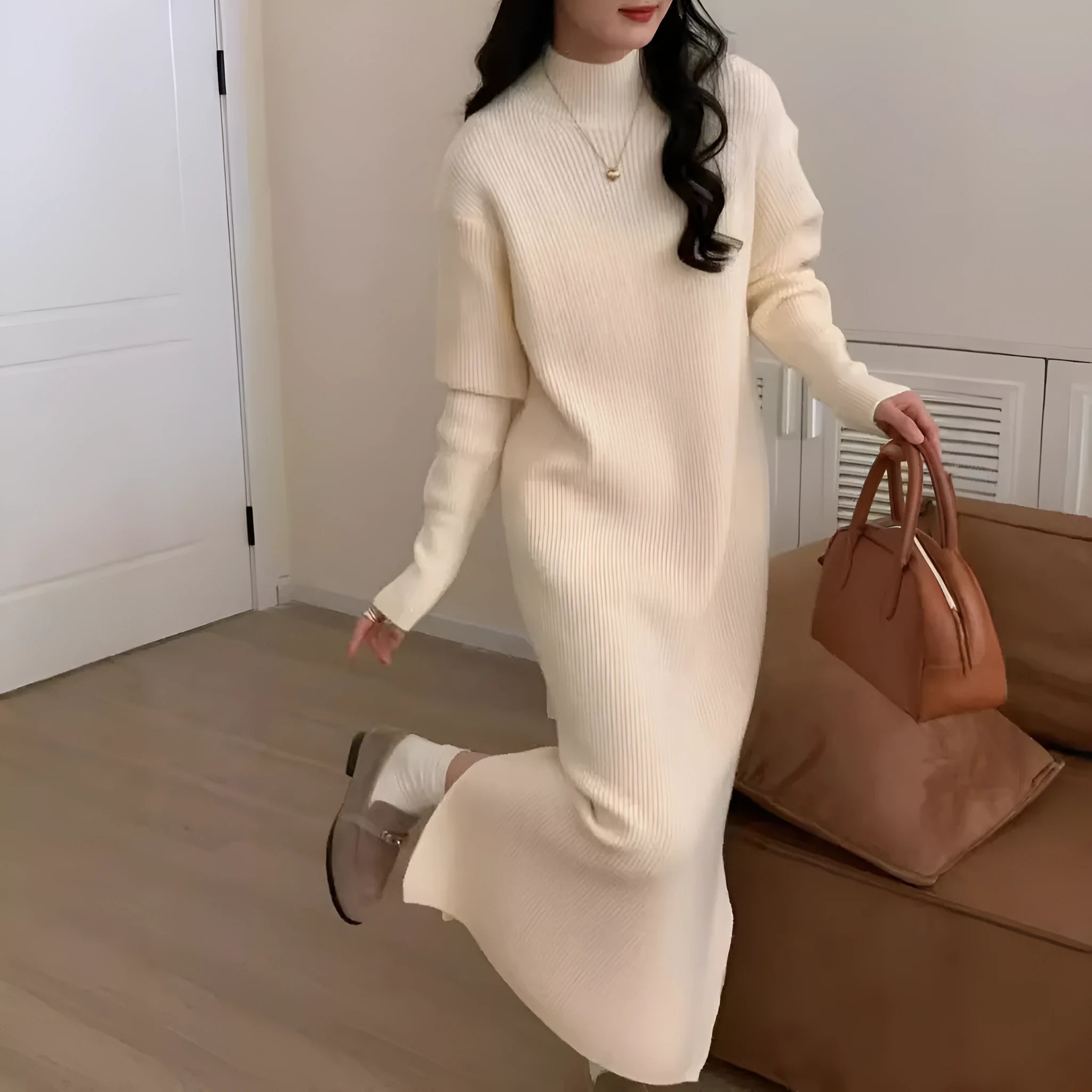 Acrylic half turtleneck long sleeve knit dress in a knee-length midi style, shown in a neutral colour.