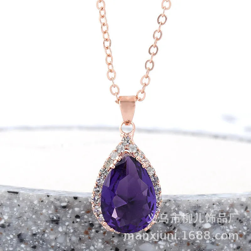Pink water drop geometric necklace with rose gold electroplating and rhinestone detailing on alloy pendant