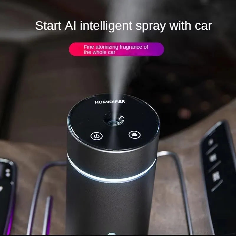 Black aluminium car humidifier and essential oil diffuser with colourful night light on, 66mm wide.