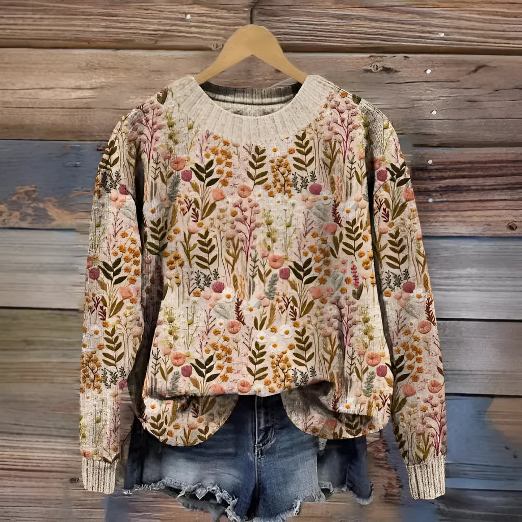 A round neck casual sweater with a small digital floral print, shown in one of thirteen available colours.