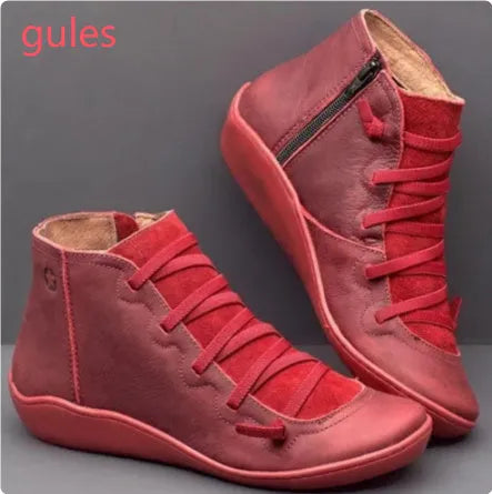 Women's casual flat booties with wedge heel and round toe in artificial PU and rubber.