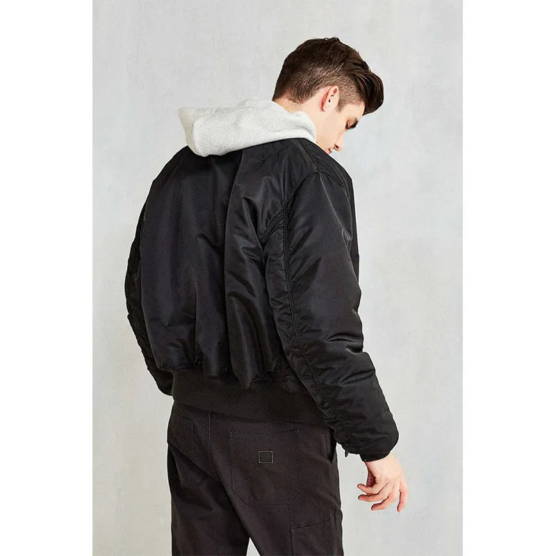 Men's loose fit pilot jacket in army green, showing cotton padding and double-sided nylon construction.