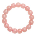 Pink crystal barrel bead bracelet with 8x10mm geometry pattern design