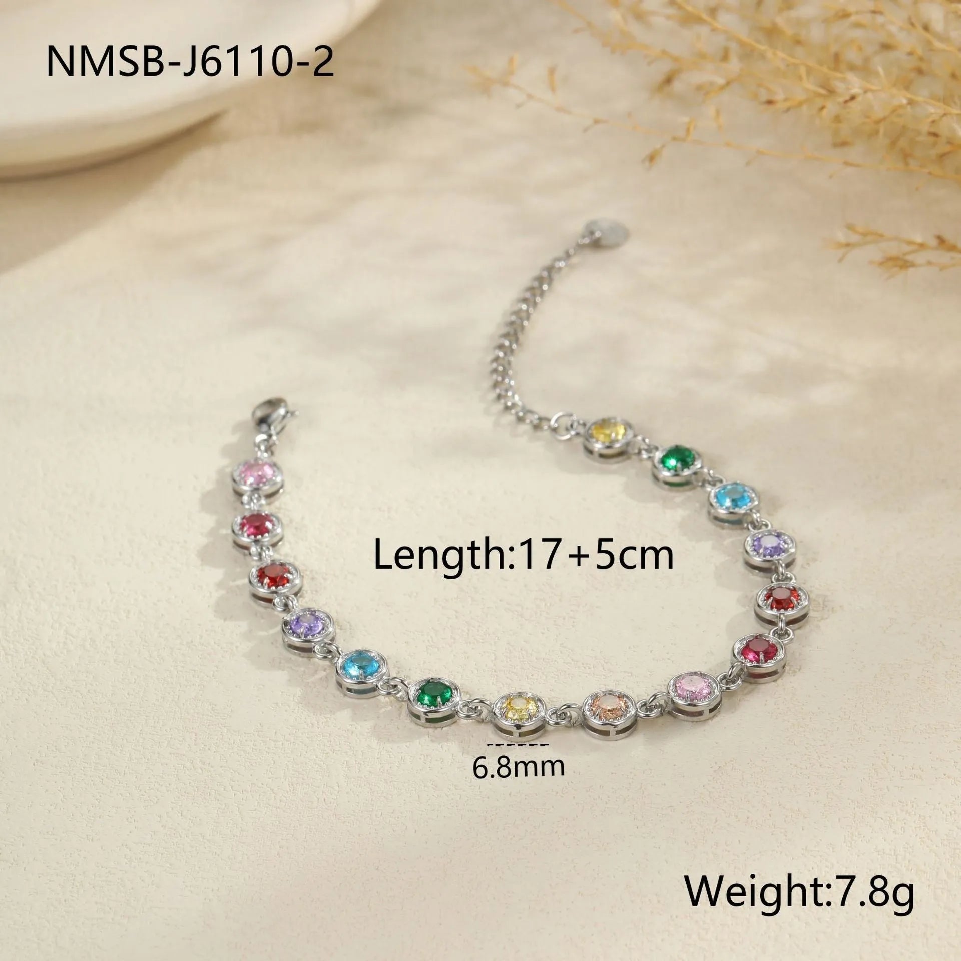Gold and silver electroplated stainless steel bracelet with square, heart, and round geometric designs