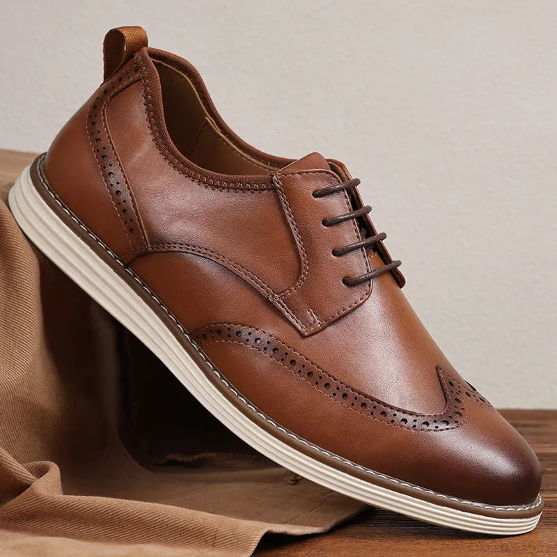 Men's black and brown slip-on business casual shoes with round toe and decorative carving detail