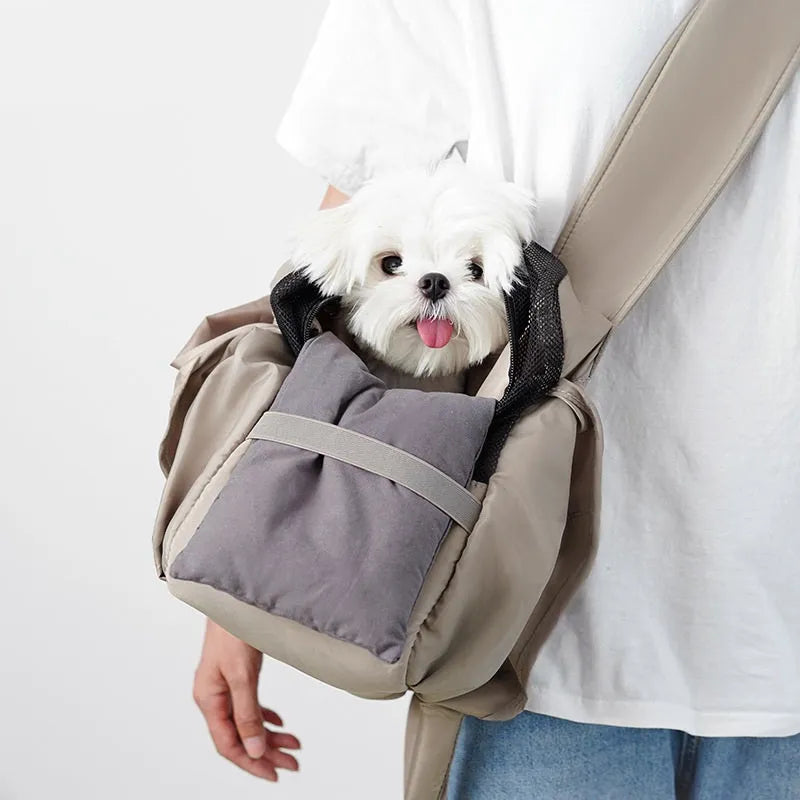 Apricot coloured cloth pet carrier handbag showing breathable fabric and portable design