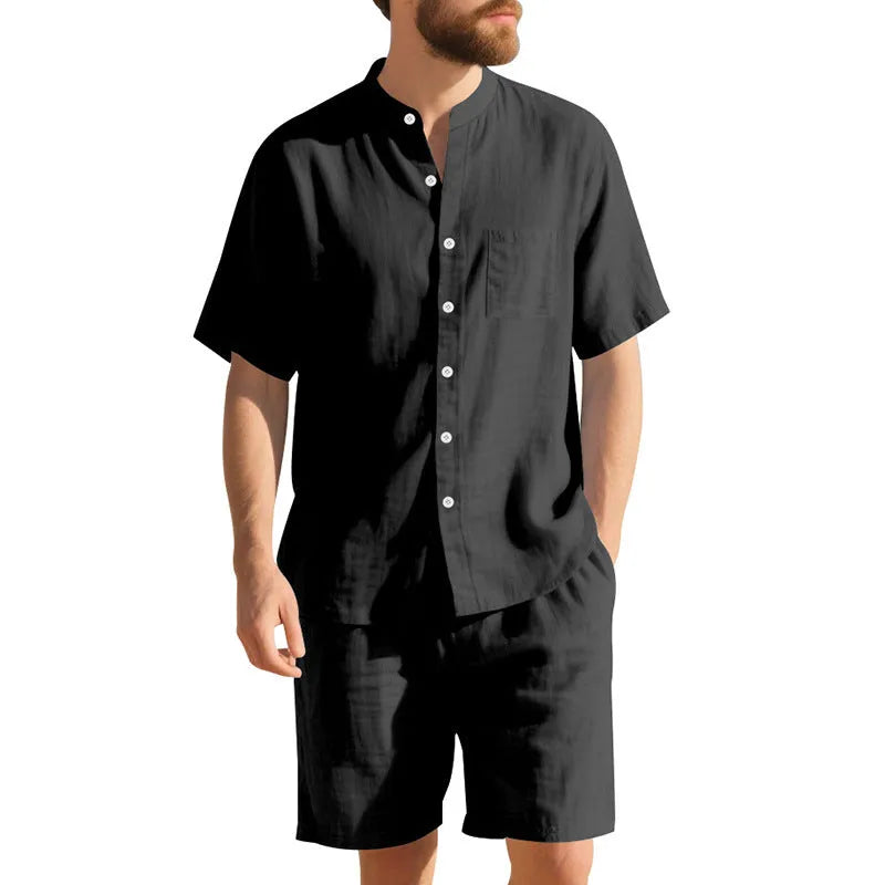 Man wearing a light blue linen blend short sleeve shirt and matching shorts, a casual summer two-piece suit.
