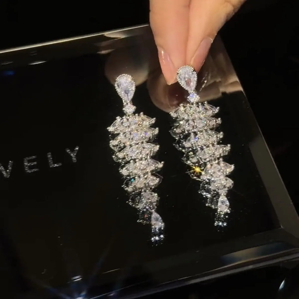 Silver pagoda colour Christmas tree drop earrings with sparkling zircon details on copper studs.