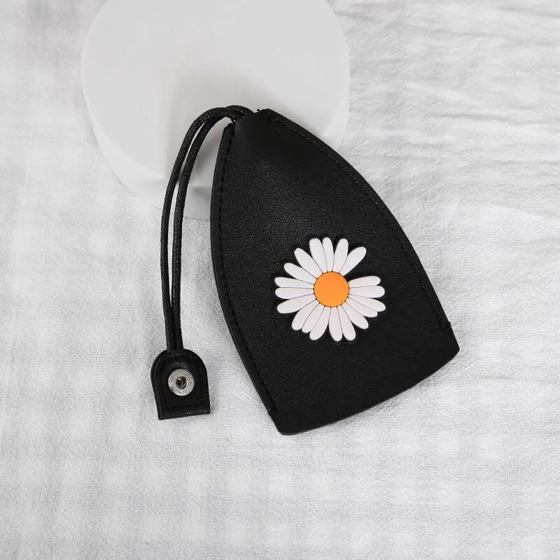 Cartoon pull-out car key case in PU leather with colourful designs measuring 14 x 7.5 cm