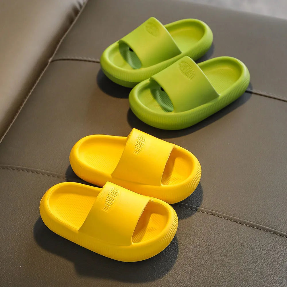 Children's non-slip EVA slippers in bright colours, showing the 1.5cm thick sole.