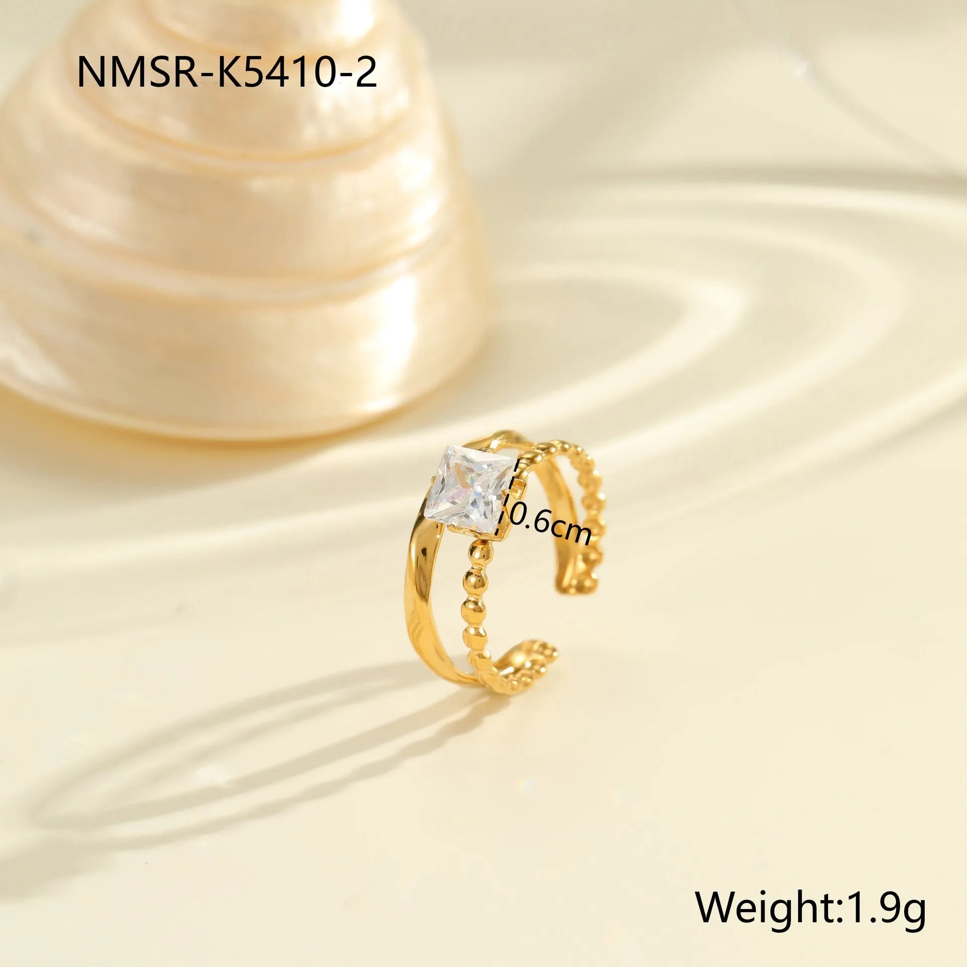 Gold electroplated stainless steel ring with zircon geometric design and open mouth adjustable fit