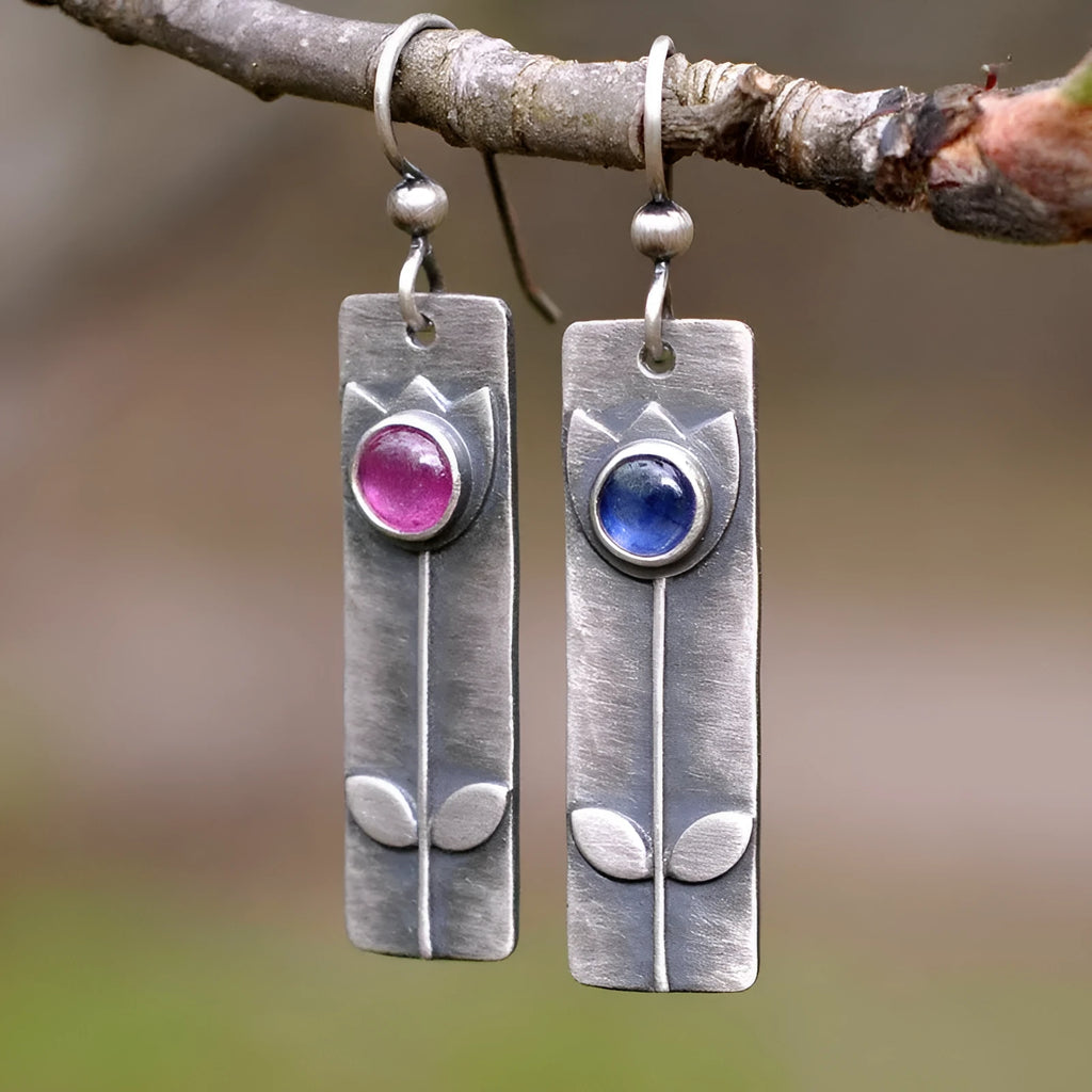 Red sapphire earrings with antique metal finish and geometric ellipse design