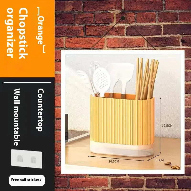 Plastic wall-mounted chopstick and spoon holder tube with drainage holes in beige colour.