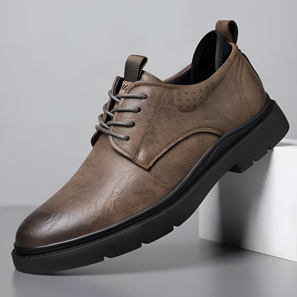 Men's black and brown leather casual sneaker with rubber sole and decorative sewing line detailing