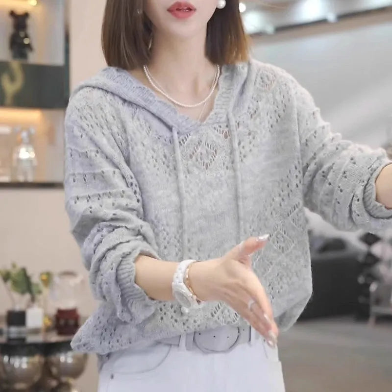 Women's blue hollow crochet hooded longsuit undershirt pullover with long sleeves.