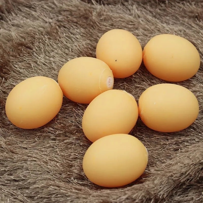 Bright coloured rubber egg-shaped dog toy with textured surface for dental cleaning