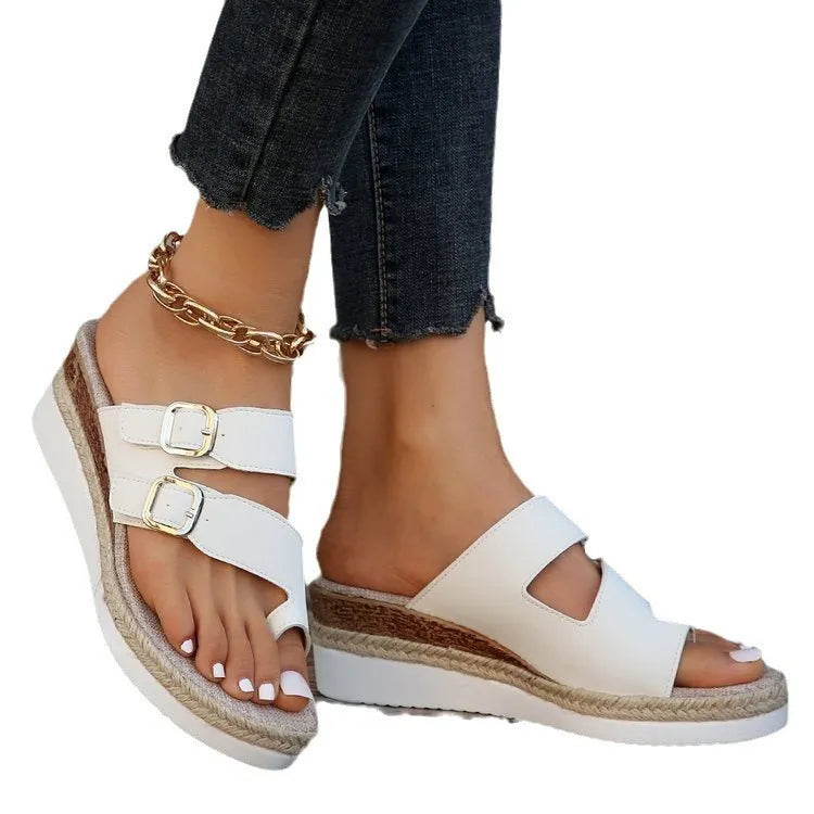 White patent leather women's sandals with wedge heel and woven finger-fit straps in peep toe design