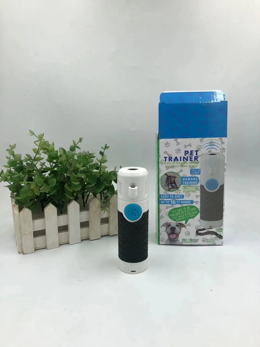 White handheld ultrasonic dog trainer for behaviour correction and bark control