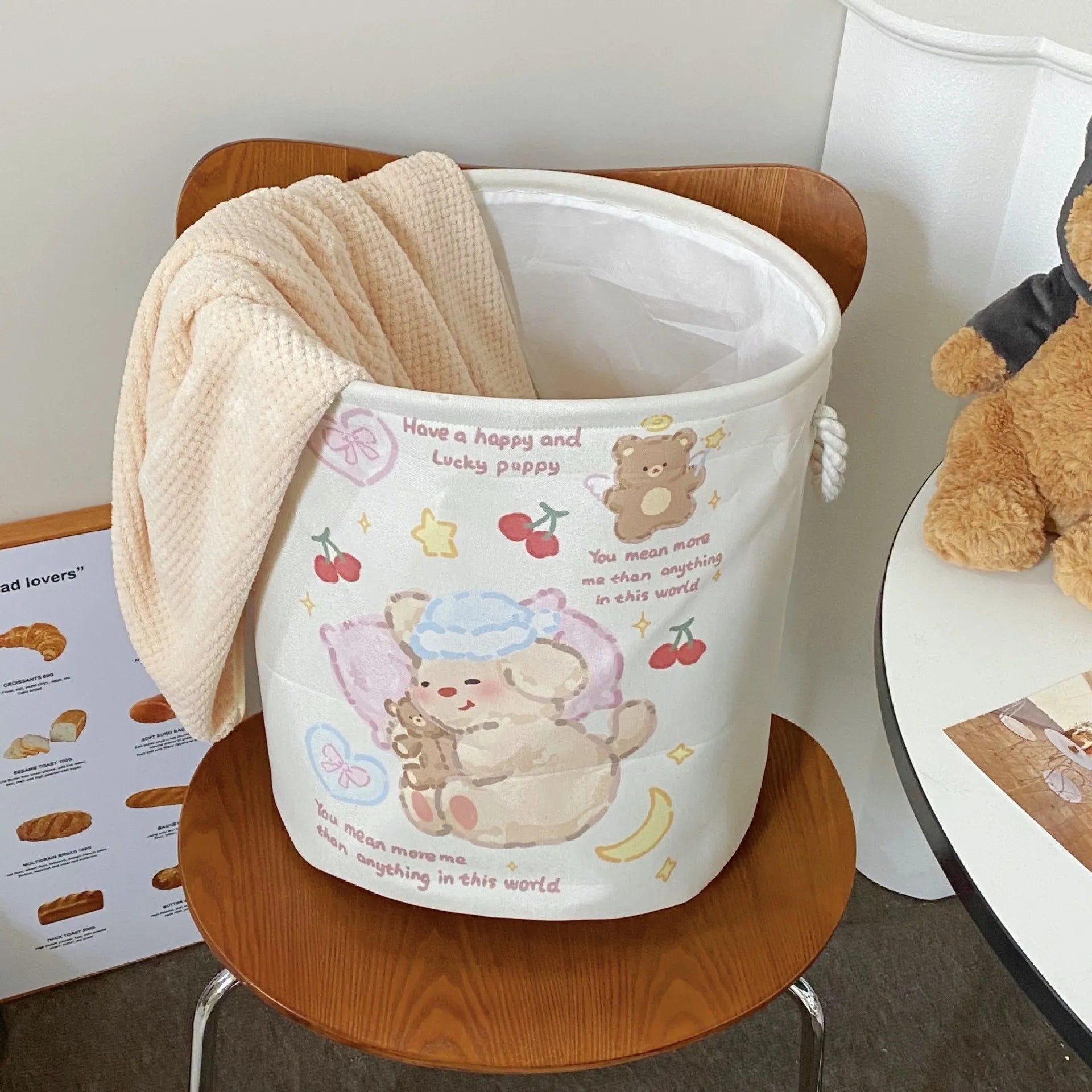 Foldable cotton laundry basket in mint green colour with bear design pattern for bedroom storage