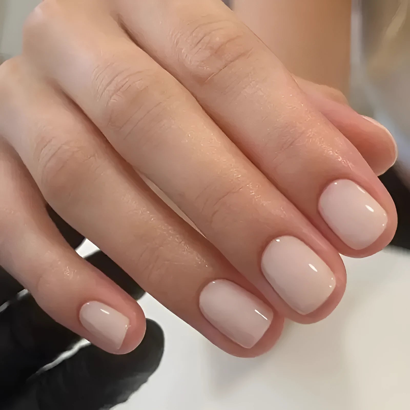 A set of solid light pink false nails (colour MY119) arranged on a card, showcasing their cute style and plastic construction.